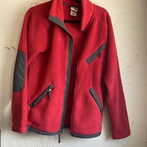 Red north face zip up